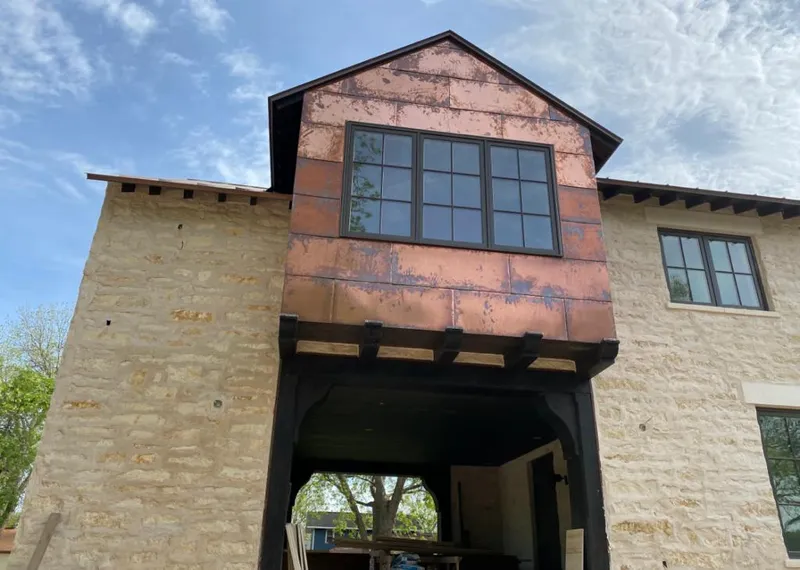 Copper metal panel facade on a stone building for Skylight Installation in Delaware