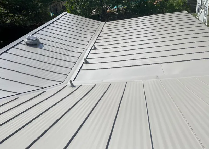Solar attic fan installed on a metal roof for Roof Ventilation in Delaware
